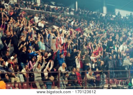 Defocused background of crowd of people in a basketball court