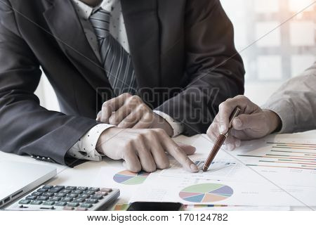 Business adviser analyzing financial figures denoting the progress in the workconsult concept.