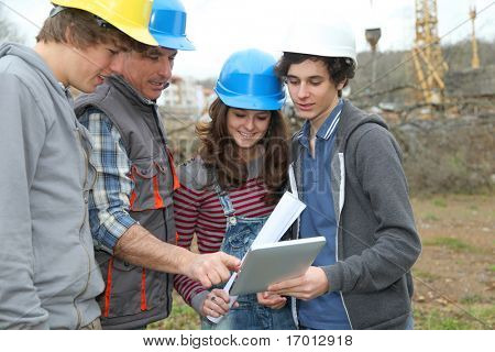 Adult with group of teenagers in professional training