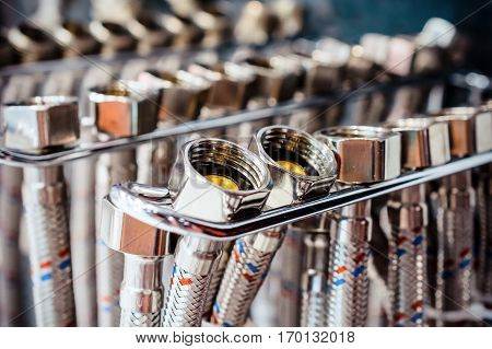 Flexible steel water hoses. Abstract industrial background.