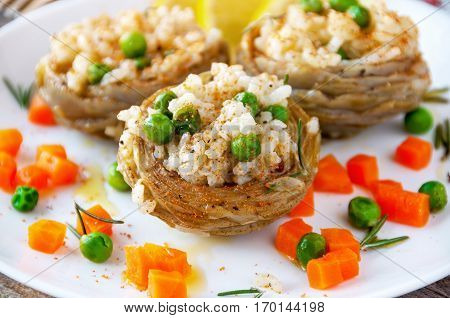 Cooked Artichokes with rice green peas carrot and olive oil. Turkish dish - Zeytinyağlı enginar. Selective focus.