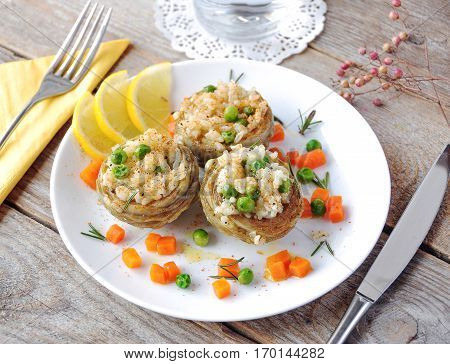 Cooked Artichokes with rice green peas carrot and olive oil. Turkish dish - Zeytinyağlı enginar. Selective focus.