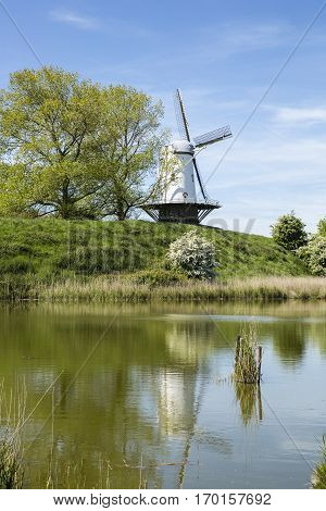 Typical Dutch landscape with a canal and a windmill, Molen de Koe, Veere, The Netherlands