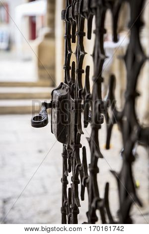 close up on the metal work of a church or castle gate