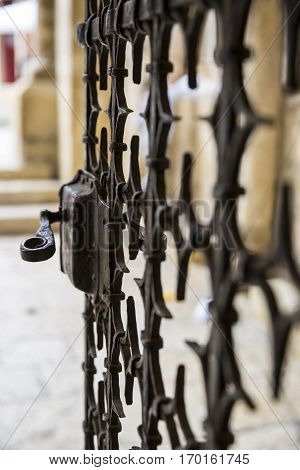 close up on the metal work of a church or castle gate