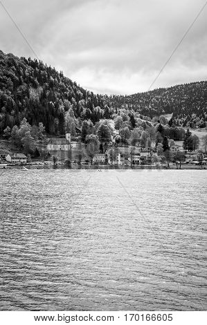 Black and white view on Joux lake -lac de Joux and the Jura mountains Le Pont Switzerland