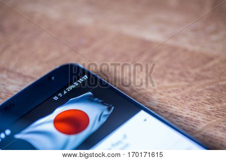 Smartphone With 25 Percent Charge And Japan Flag