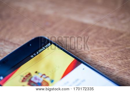 Smartphone With 25 Percent Charge And Spain Flag