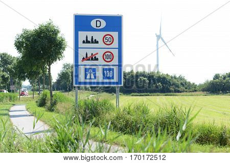 Photo with German border sign on the road.