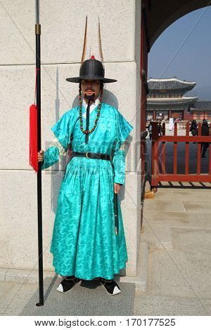 SEOUL - NOV 4, 2015: Korean monk in historical costume with hat in Gyeongbokgung