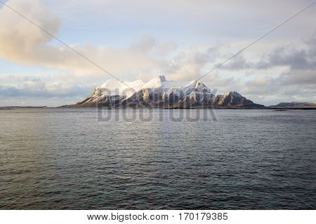 View of a Norwegian fjord with snowy mountains Nordland Norway