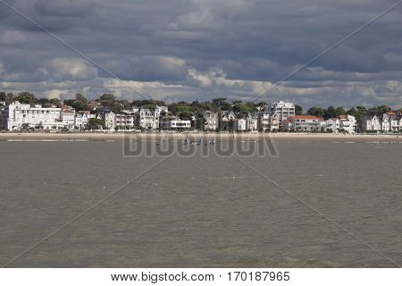 View of the coastline with seaside resort of Royan with grey tourmented sky France