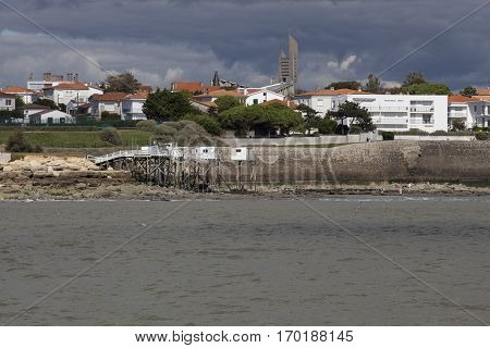 View of the coastline with seaside resort of Royan with grey tourmented sky, France