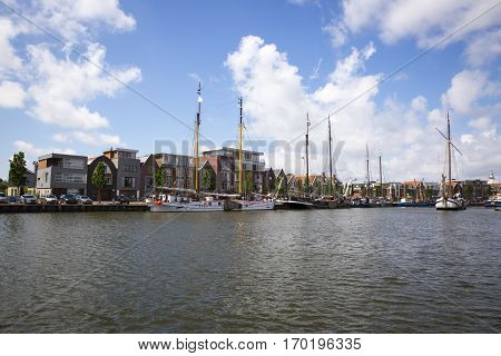 Noorderhaven canal with boats and houses in historic old town of Harlingen Friesland Netherlands