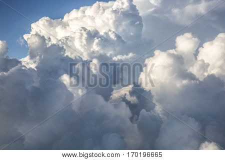 close up on threatening white fluffy storm clouds
