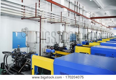 View on plastic injection CNC machines at empty workshop