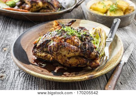 Spring Chicken With Potatoes and Vegetable on Plate