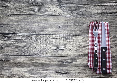 Good background to create restaurant menus, cafes bars, a wooden table with fork and knife. Can be used for restaurante or bar menu list. Menu background template. Steak house menu design.