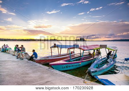 FLORES, GUATEMALA-DEC 20, 2015: Tourist boat at Peten Iitza lake in Flores on Dec 20, 2015. Guatemala.
