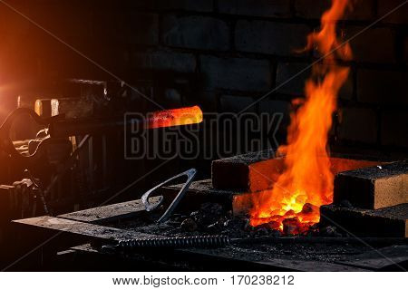 blacksmith forged iron traditional hammer beating. stoke