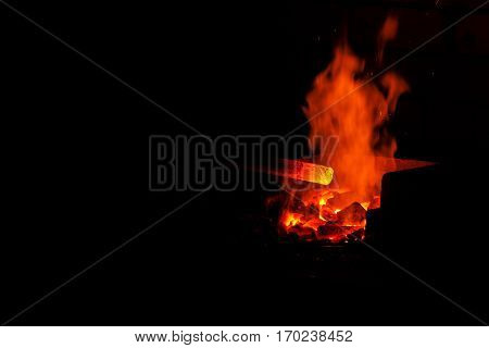 blacksmith forged iron traditional hammer beating. stoke