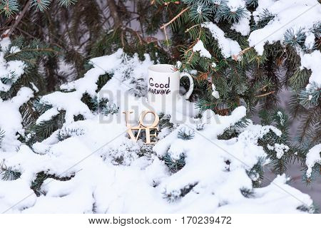 white cup with text or inscription 