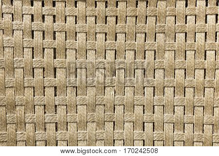 Texture of a handmade brown esparto plait.
