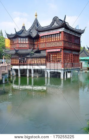 SHANGHAI - AUG. 13, 2012: Huxinting Teahouse, Yu Gardens, Shanghai, China. This building was built in 1784 by cotton merchants, and became a teahouse since late 19th century. It's a famous landmark in Shanghai Old City.