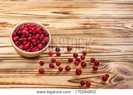 Cranberry. Cranberries On Glay Plate Wooden Background