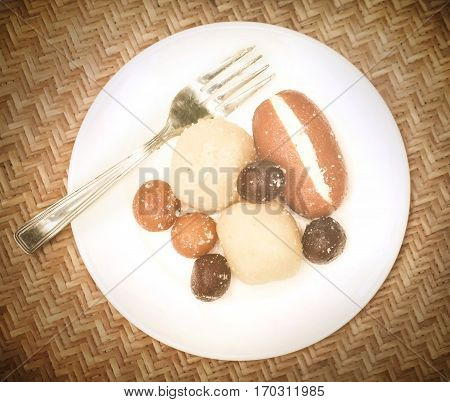Popular Bangladeshi Sweetmeats in a plate with fork
