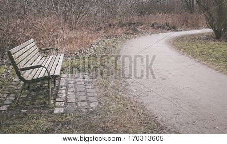Lonely old wooden bench outdoor in Brunevang Rodovre Denmark