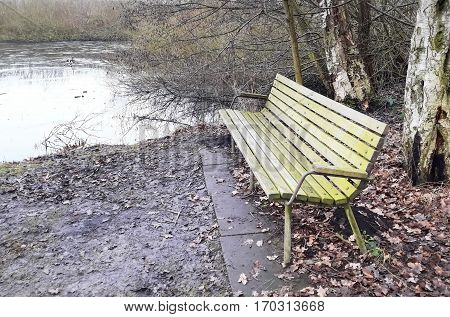 Lonely old wooden bench outdoor in Brunevang Rodovre Denmark