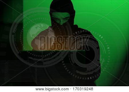 Hacker man in hoodie shirt typing hacking global netwok security on computer laptop over dark background with green light