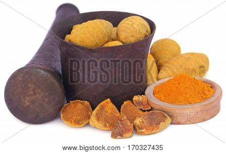 Whole and ground turmeric with mortar and pestle