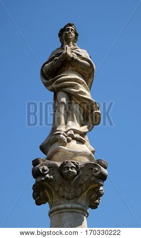 KRAPINA, CROATIA - APRIL 21: Statue of Virgin Mary on a column in front of the Church of St. Catherine of Alexandria in Krapina, Croatia on April 21, 2016.