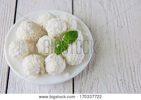 Homemade coconut candies with filling of cream and nut