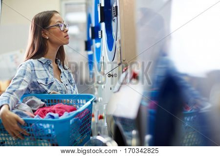 Maid with laundry-basket