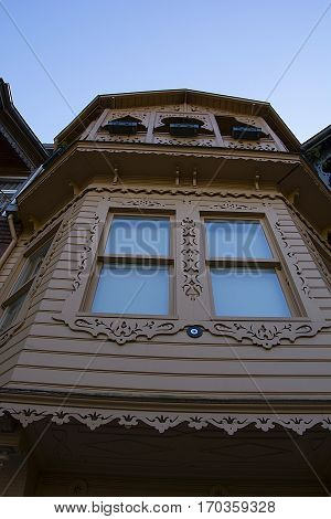 Old pink wooden house. Life is still going on