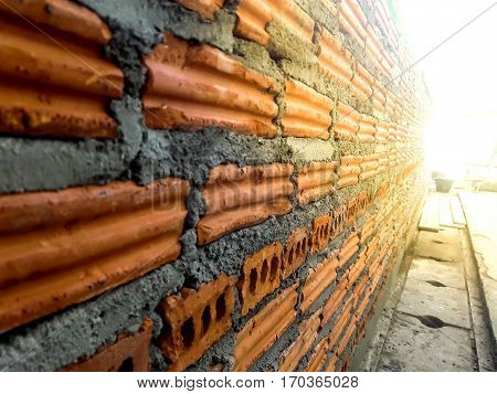 Background of brick wall texture  of industrial bricklayer installing bricks on construction site