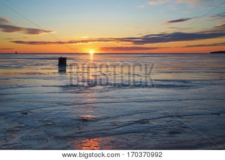 Ice fishing shack at sunset along the shores of rural Prince Edward Island.