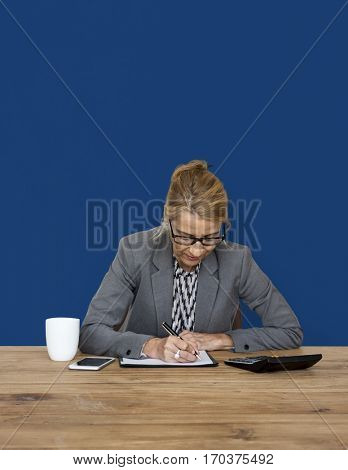 Businesswoman writing down a plan and strategy