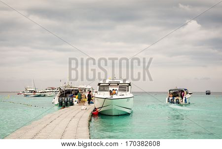 PHUKET THAILAND - FEB 01 : Group of tourist with speed boats in raya island Which is one of the most famous tourist attraction on February 01 2017. Phuket Thailand