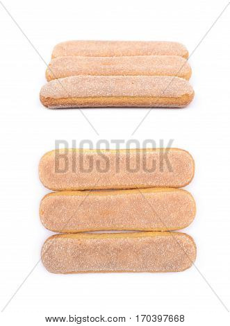 Ladyfinger savoiardi biscuit cookies lined up, composition isolated over the white background, set of two different foreshortenings