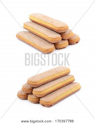 Pile of multiple ladyfinger savoiardi biscuit cookies, composition isolated over the white background, set of two different foreshortenings