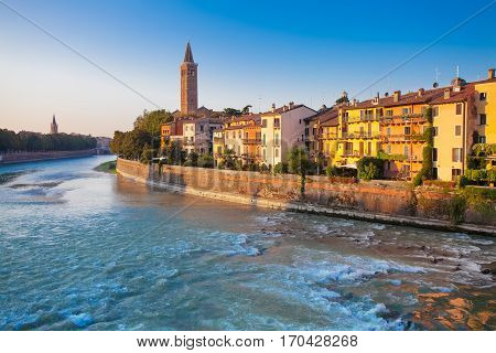 VERONA ITALY- September 08 2016: Morning scenery with Adige River Bell tower of Santa Anastasia's church and the embankment of Adige River.