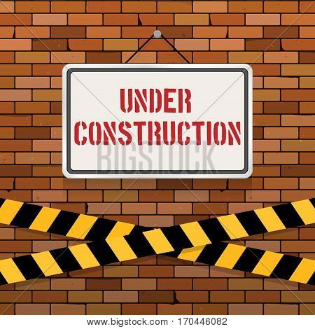 Simple white sign with text 'Under Construction' hanging on a red brick wall with warning tapes. Grunge brickwork background. Building engineering concept. Creative template for web design
