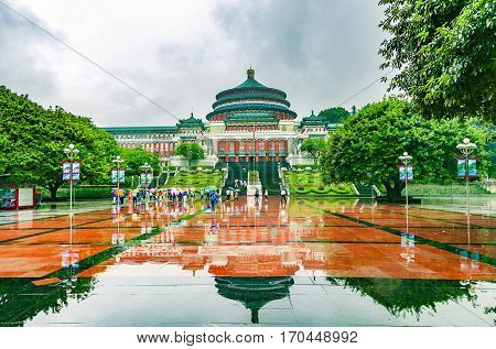 CHONGQING CHINA - September 19 2015: The Great Hall of the People in central of Chongqing was in raining day with tourist raise an umbrella The one of the architectural landmark of Chongqing.