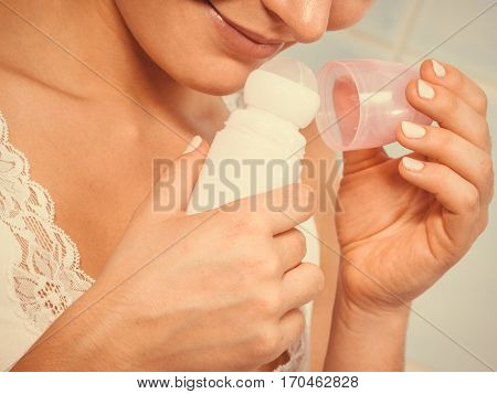 Woman Holds Stick Deodorant Cosmetic In Hands