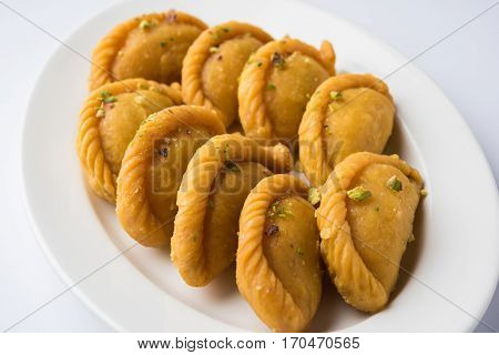 Gujiya - sweet dumplings made during the festival of holi and diwali, selective focus