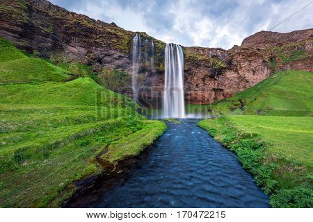 Sunrise on Seljalandfoss waterfall on Seljalandsa river, Iceland, Europe.